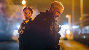 A photo of a street at night with two coppers. Scene from The Responder.
